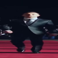 Wide Zelenskyy Wide Zelenskyy Zelensky Walking meme depicting Ukrainian president Volodymyr Zelenskyy walking down a red carpet.