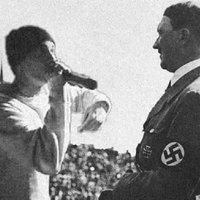 Eminem vs Hitler meme format depicting an edited image of rapper eminem rap battling with adolf hitler.