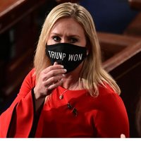 Marjorie Taylor Greene wearing a "Trump Won" mask in Congress.