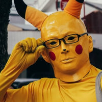 Pikachu Man Pikachu Man meme depicting an image of a man wearing a human-like face and yellow morphsuit with glasses on.