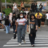 Fashionable people walking in the street at Citayam Fashion Week