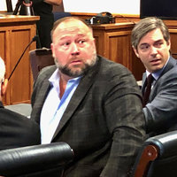 Alex Jones Turning Around In Court meme template and format depicting Jones and his lawyer turning around to look behind them in his defamation trial.