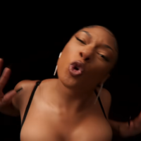 Megan Thee Stallion Pushing meme depicting the rapper pushing away the camera from her music video for her song Plan B.
