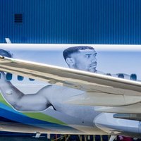 Russell Wilson Working Out On a Plane
