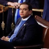 George Santos in a sweater.