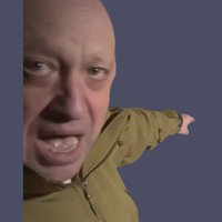 Wagner Group chief Yevgeny Prigozhin pointing behind him