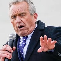 Robert F. Kennedy Jr. / RFK Jr. Robert F Kennedy Junior, holding a microphone.