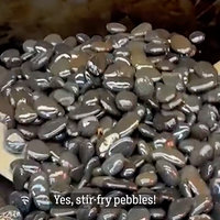 China's Stir-fried Stones meme depicting a griddle with pebbles being tossed in oil.