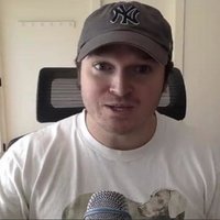 Brad Troemel, wearing a baseball cap and streaming.