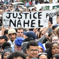 Protestors carrying a sign during the 2023 protests in france.