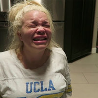 Trisha Paytas Crying On The Floor meme format depicting YouTuber Trisha Paytas crying on her kitchen floor wearing a shirt with UCLA on it.