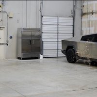 Joe Rogan shooting Tesla's cyber truck with an arrow.