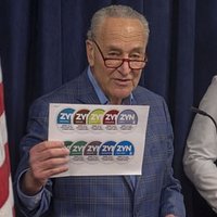 An image of Senate Majority Leader Chuck Schumer holding a sign displaying Zyn products in reference to the Federal Zyn Crackdown or Zynsurrection.
