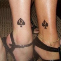 Queen of Spades Tattoos depicted on four women's ankles.