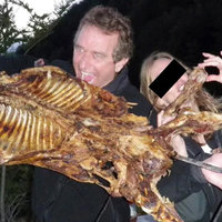 RFK Jr Dog Photo depicting him and a woman eating a BBQ animal carcass.