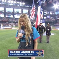 A still from the viral video of Ingrid Andress singing the national anthem.