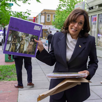 Kamala holding the vinyl record "The Slits - Cut"