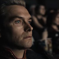 Homelander Watching a Movie Homelander Watching a Movie meme depicting the boys character homelander, antony starr, sitting in a dark theater staring at a screen.