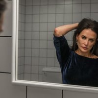 Demi Moore looking at the mirror in a scene from The Substance.