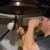 An image of Speedbag Bard punching a speedbag.