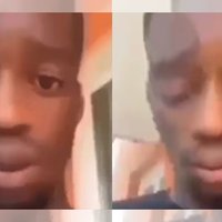 A close-up of a man's face with his eyes closed and his mouth open