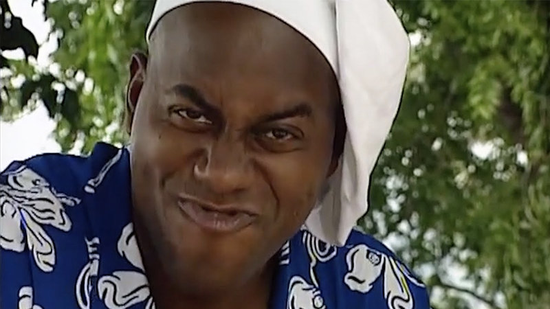 Ainsley Harriott in a chef's hat