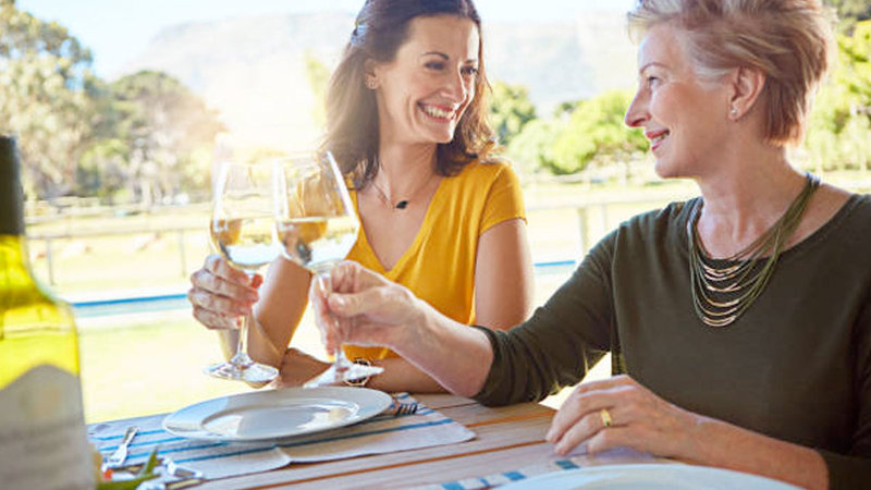 two women drinking wine