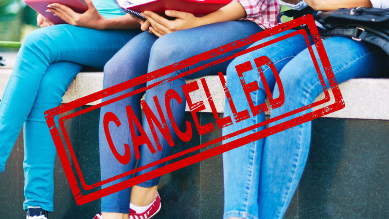 People wearing skinny jeans with a "canceled" stamp overlaid on top of the image.