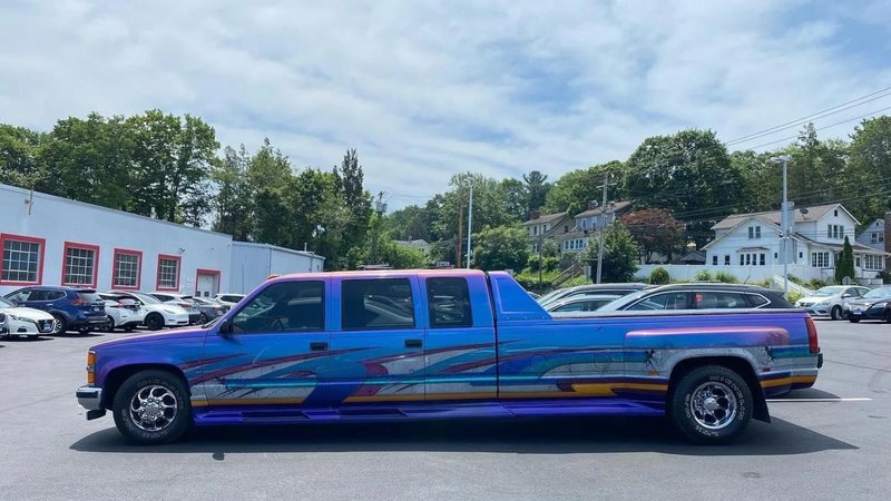 A holographic rainbow truck and limo hybrid.