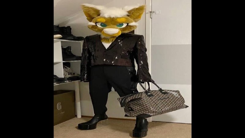 Rick Owens Furry meme depicting a photo of a furry dressed in Rick Owens clothing with a fox head, leather outfit and designer bag.