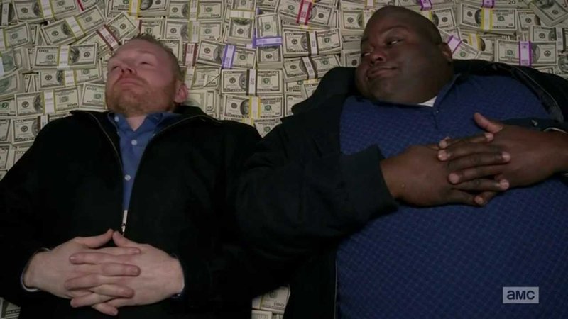 Huell Rolling In Money meme format depicting the breaking bad characters Huell and Kuby laying on a pile of bundled cash.