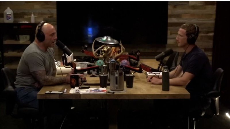 Zuckerberg and Rogan sitting together, speaking during his podcast.