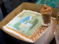 Birthday cake with a picture of two girls and a decorative cup filled with brown mousse
