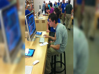 Hunched Over at the Apple Store