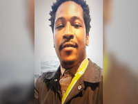 rayshard brooks wearing a brown jacket