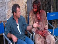 mel gibson speaking with Jim Caviezel on the set of passion of the christ