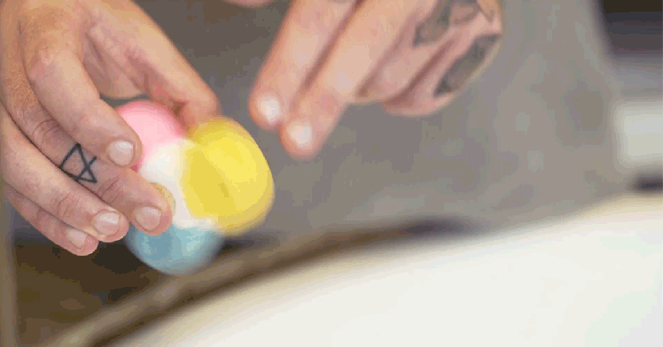 LUSH's Bubble Spinner A fidget spinner-shaped bath bomb in motion.