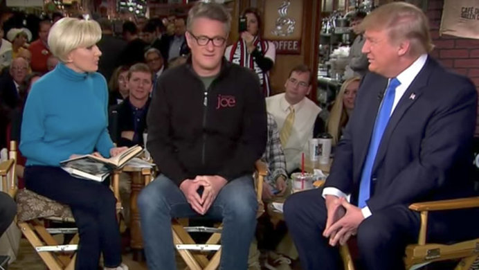 Donald Trump sits with Mika Brzezinski and Joe Scarborough on a Morning Joe interview.