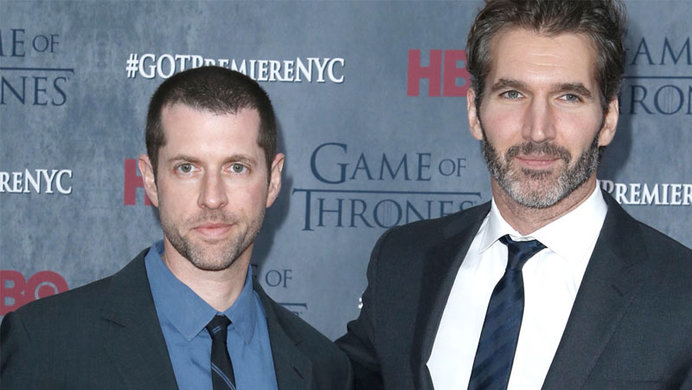 Game of Thrones Showrunners, D.B. Weiss and David Benioff posing for pictures at the Game of Thrones premiere standing before a Game of Thrones backdrop.