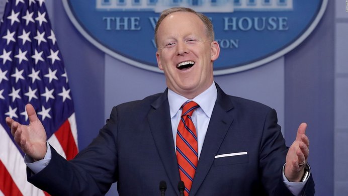 Sean Spicer laughing at White house press podium