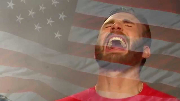 chris evans laughing with he american flag in the background