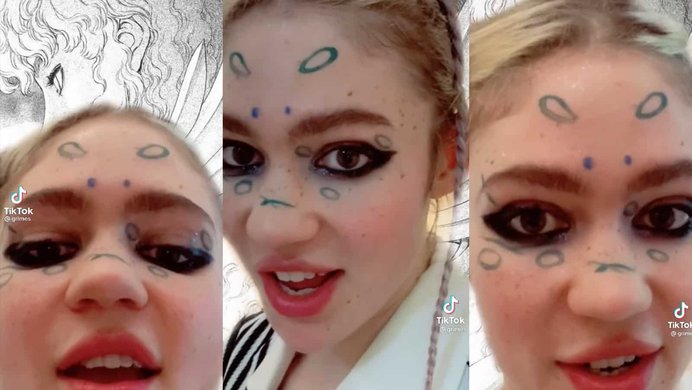 Grimes with circles painted on her face discussing communism on her tiktok.