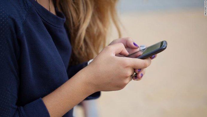 woman looking at phone