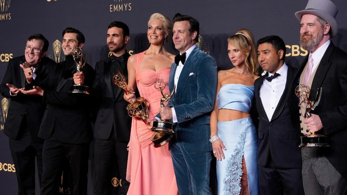 A photo of several Emmy winners on the red carpet.