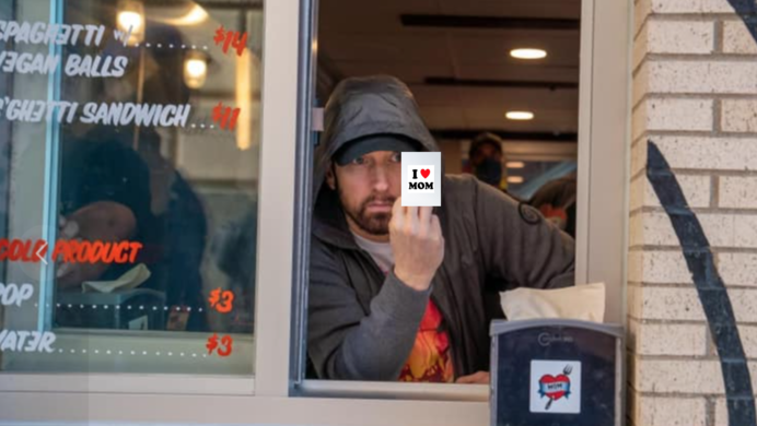 Eminem at the mom's spaghetti restaurant in detroit flipping a bird at someone in the drive-thru.