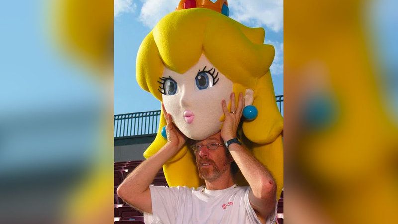 Man Pulling Off Peach Mascot Head To Become A Meme, Source Of Controversy