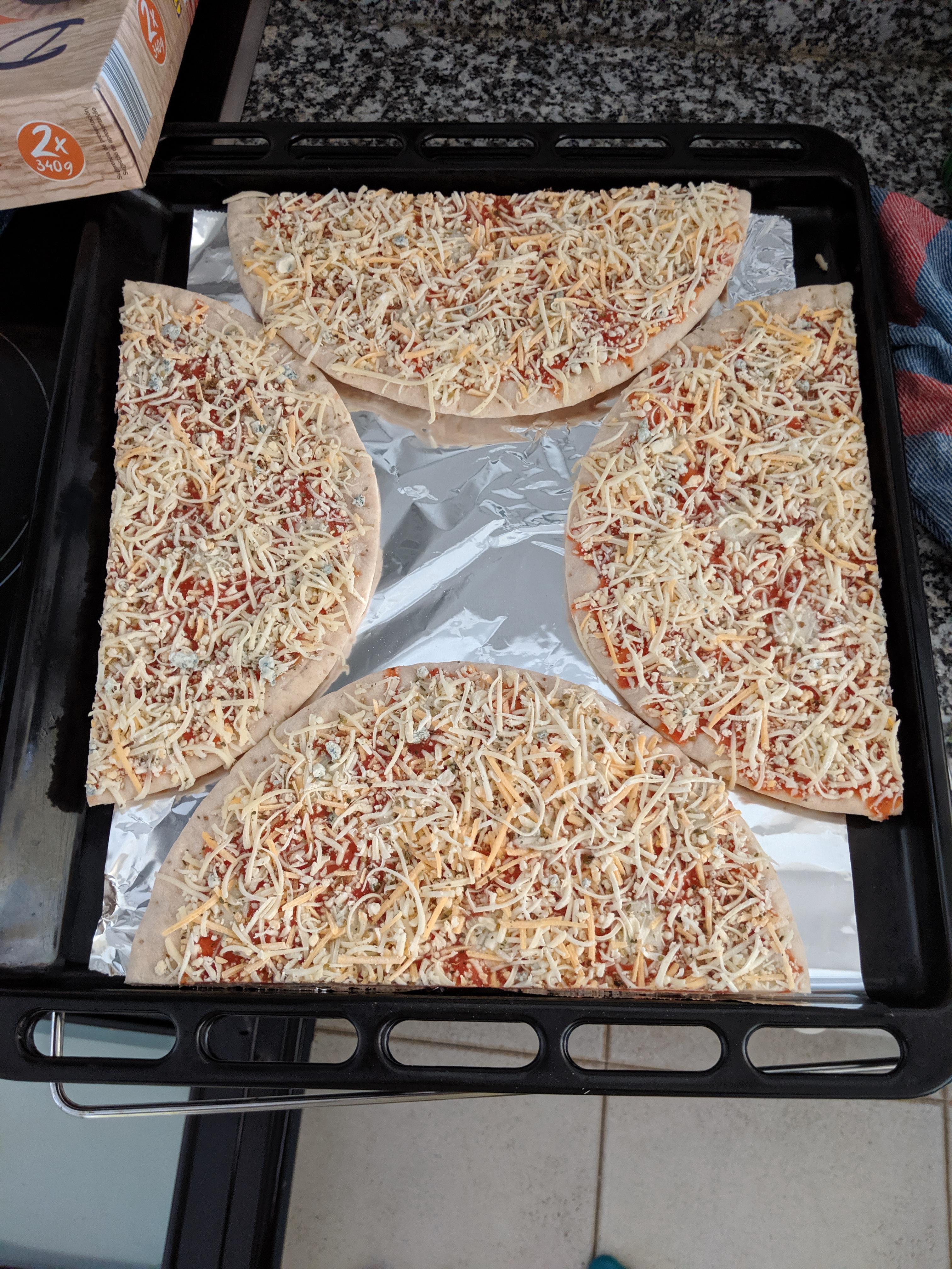 This is how I managed to fit 2 oven pizzas on the tray without them