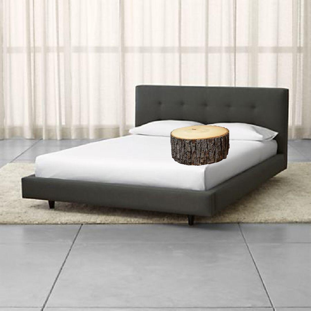 Taken a Little Too Literally Wood Sitting on a Bed / Barry Wood