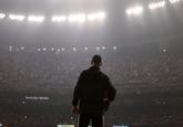 An official looks on during a Superdome power outage in the second half of the NFL Super Bowl XLVII football game between the San Francisco 49ers and the Baltimore Ravens, Sunday, Feb. 3, 2013, in New Orleans. (AP Photo/David Goldman)