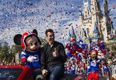 (FEB. 4, 2013): Super Bowl XLVII MVP Joe Flacco rides Feb. 4, 2013 with Mickey Mouse in a parade through the Magic Kingdom at Walt Disney World Resort in Lake Buena Vista, Fla. Flacco led his Baltimore Ravens to a 34-31 win over the San Francisco 49ers last night in New Orleans.  After the game, Flacco starred in a commercial where he proclaimed "I'm Going to Disney World!" (Matt Stroshane, photographer)